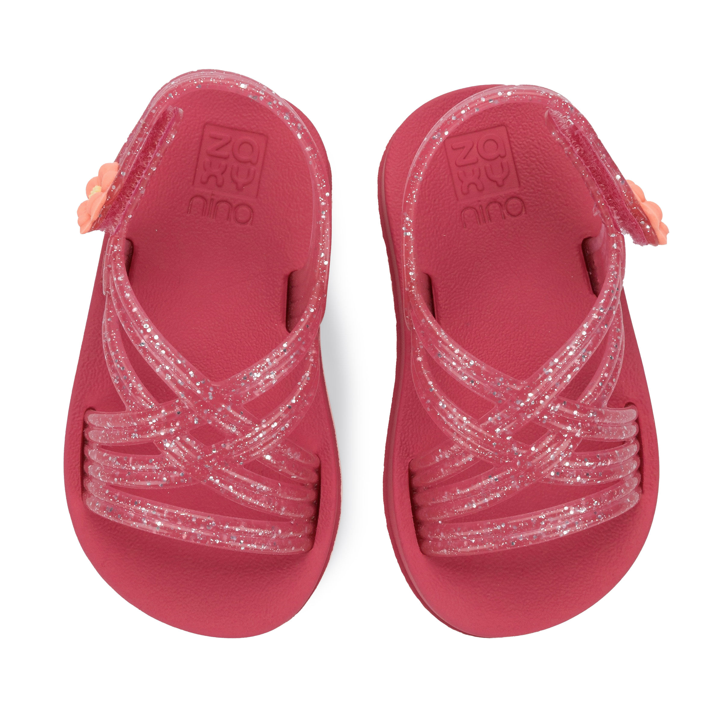 Vista superior da sandália infantil rosa com tiras translúcidas glitter e sola plataforma